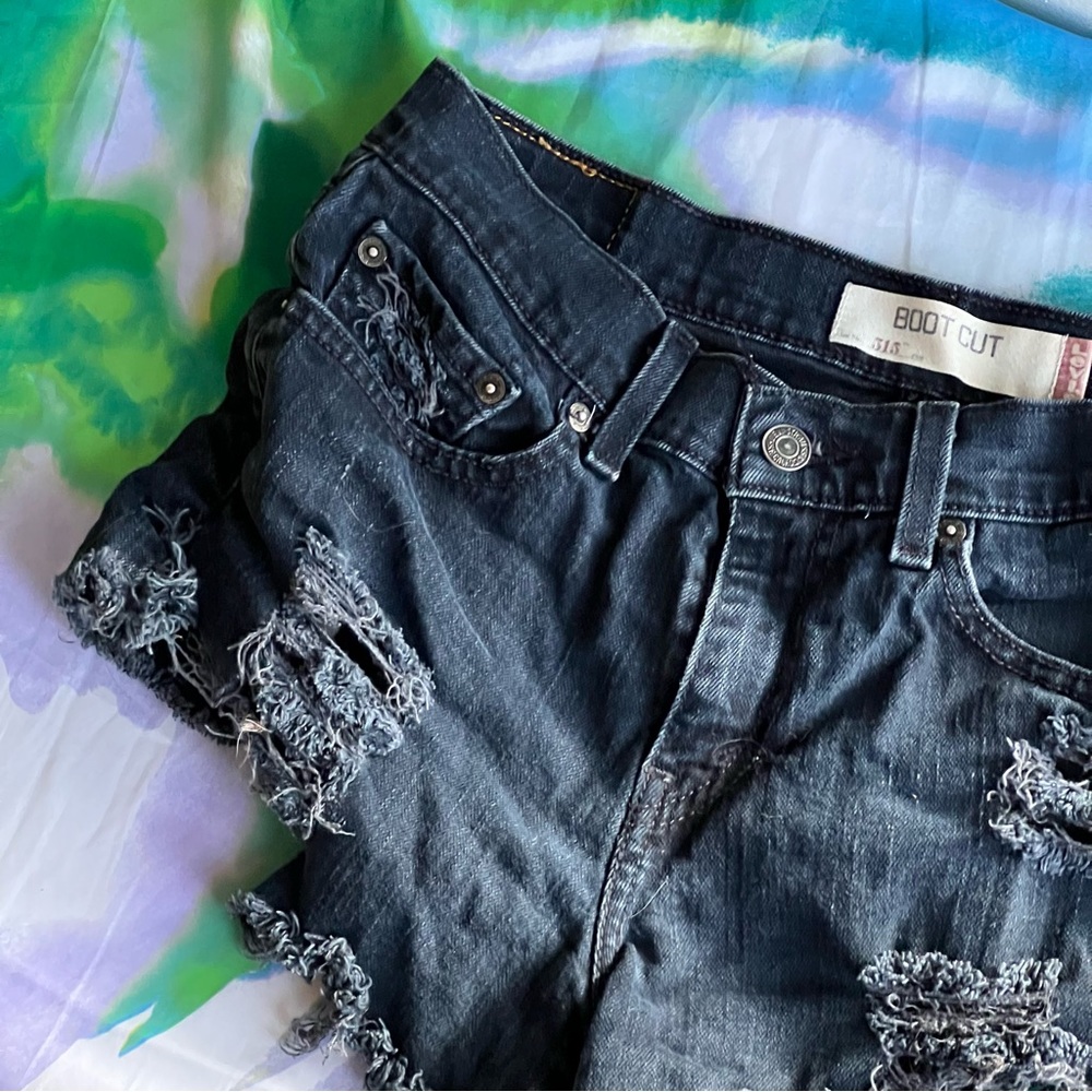 Levi’s distressed high waisted dark wash jean cutoffs